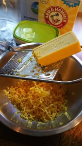 Using a cheese grater to shred the soap